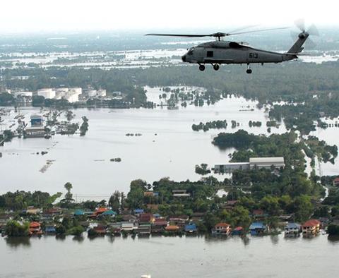 Helicopter surveying flood